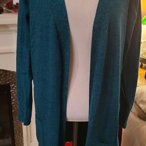 Duster style sweater with pockets.